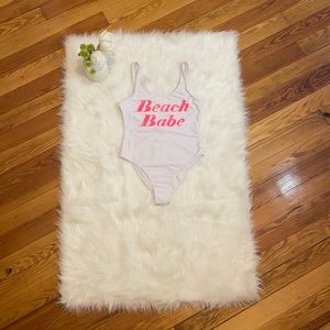 Revamped. Swim suite. White suite. Pinks graphics, beach babe. Size Small.